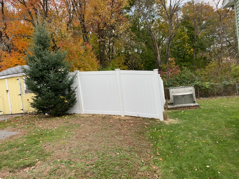 For this homeowner in Nashua, NH, we installed 6' tall white vinyl privacy fencing.