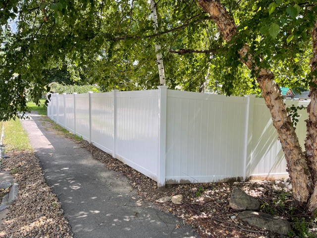 We installed 6’ white vinyl privacy fencing for this property owner in Nashua, NH.