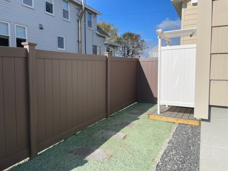 Granite State Fence installed Bufftech wood grained vinal fencing for this property in Wells, ME.