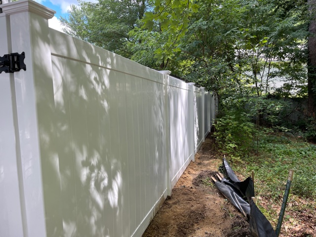 We installed 6’ white vinyl privacy fencing for this property owner in Nashua, NH.