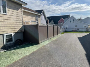 Granite State Fence installed Bufftech wood grained vinal fencing for this property in Wells, ME.