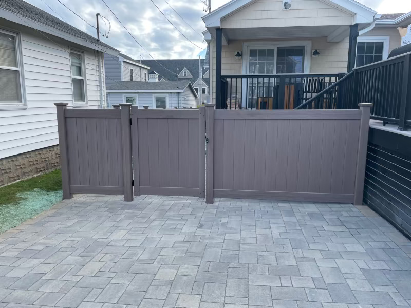 Granite State Fence installed Bufftech wood grained vinal fencing for this property in Wells, ME.