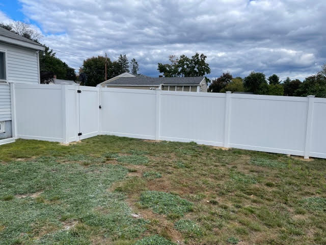 We installed 6’ white vinyl privacy fencing for this yard in Manchester, NH