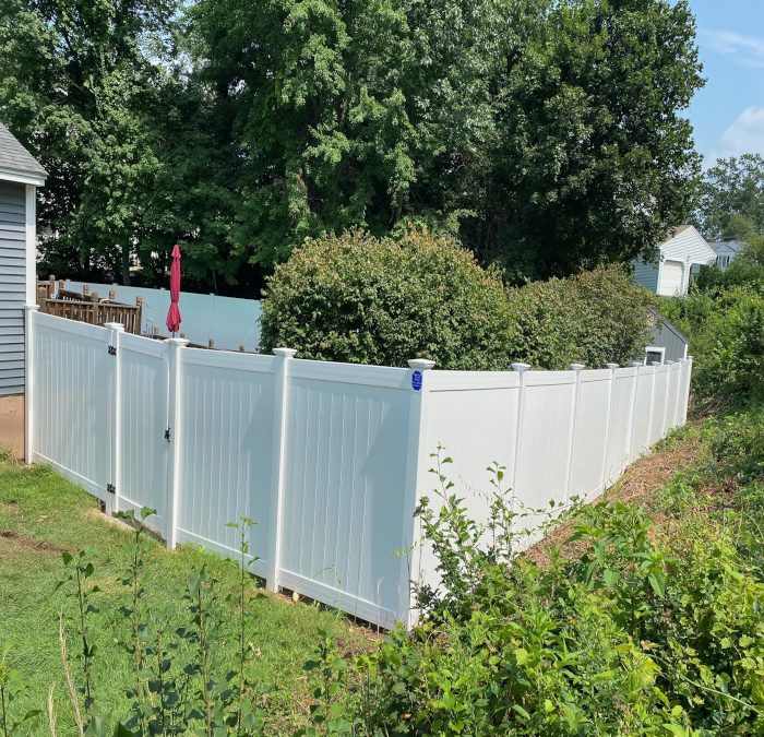 White Vinyl Privacy Fence installed in Nashua, NH.