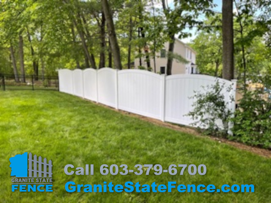 Scalloped White Vinyl Fence installed in Manchester, NH.