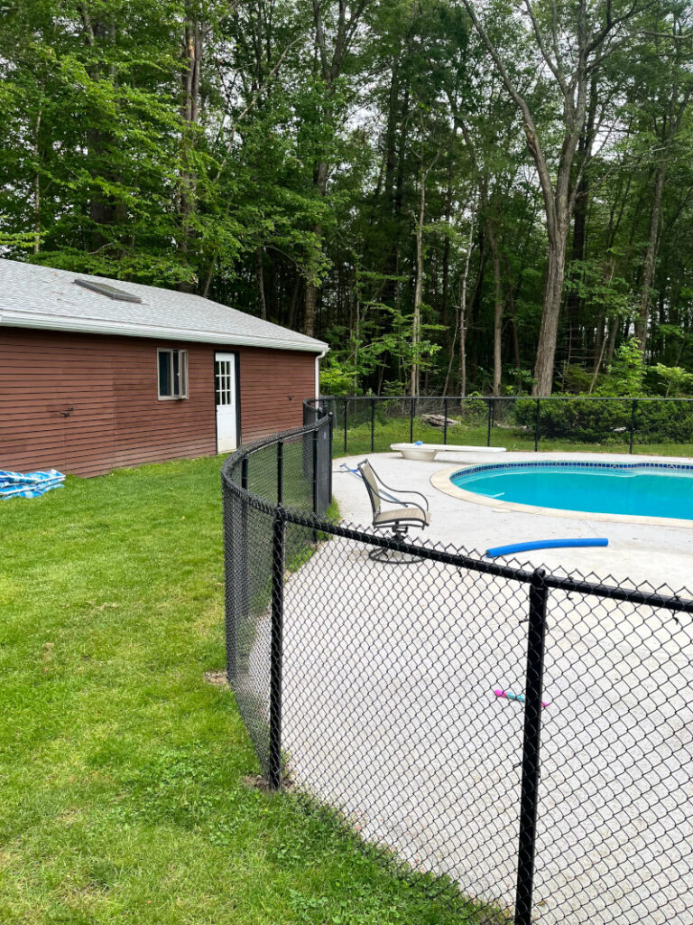 For this job in Londonderry, NH, we installed black chain link mini mesh around this beautiful pool! At Granite State Fence Company, quality pool fencing installed correctly for maximum safety at an affordable price is our goal.