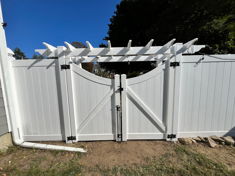 Vinyl Fencing with attached Pergola installed in Nashua, NH.