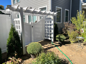 Vinyl Fencing with attached Pergola installed in Nashua, NH.