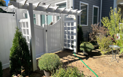 Vinyl Fencing with attached Pergola installed in Nashua, NH.