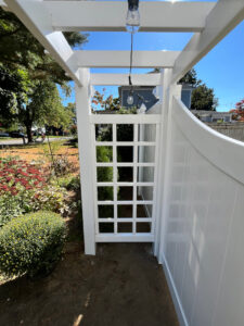 Vinyl Fencing with attached Pergola installed in Nashua, NH.