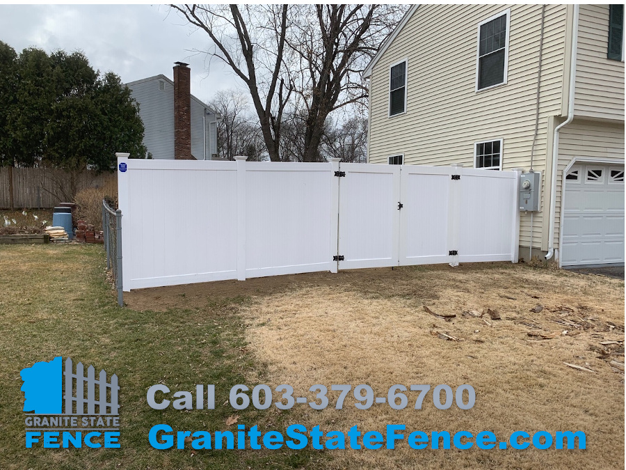 White Vinyl Privacy Fence for a large backyard containment area in Nashua, NH