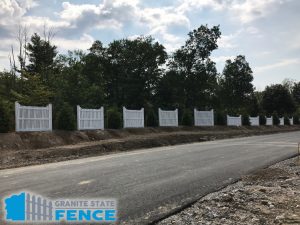 Vinyl panel fence installation in Windham, New Hampshire.