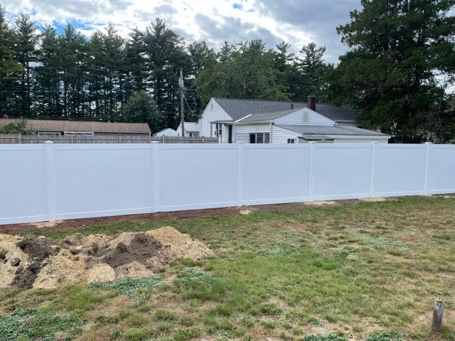 We installed 6’ white vinyl privacy fencing for this yard in Manchester, NH