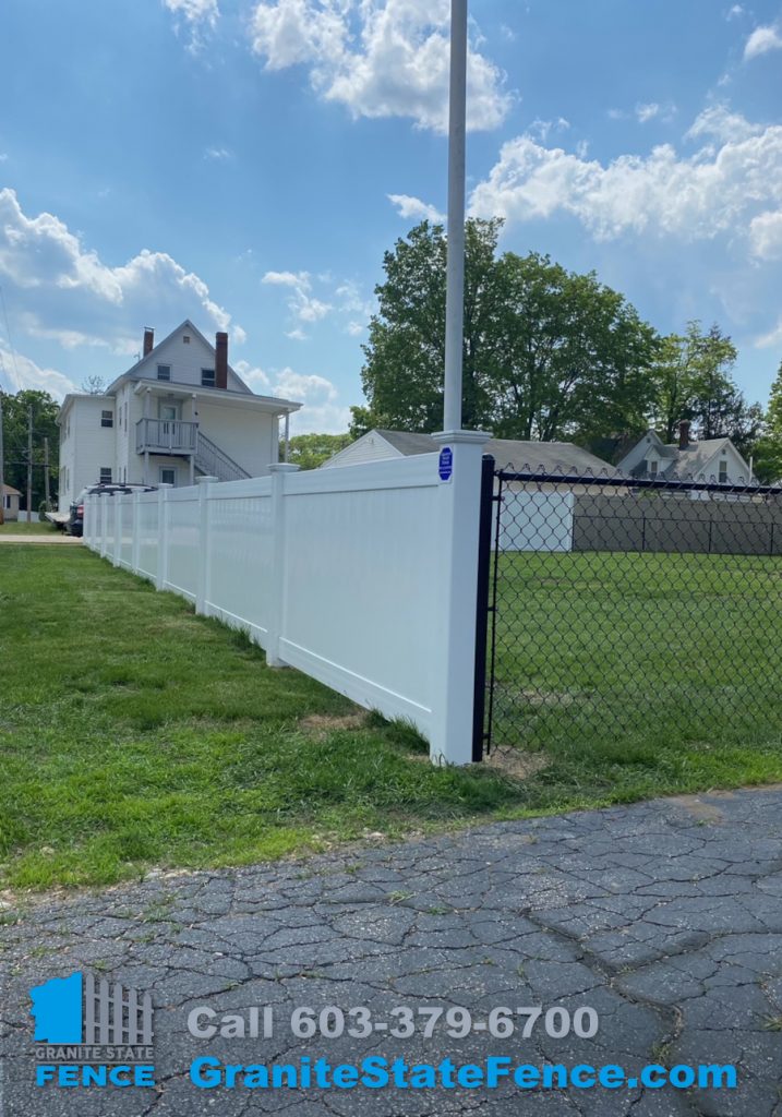 White Vinyl Fencing and Black Chain Link Fencing installed in Manchester, NH.