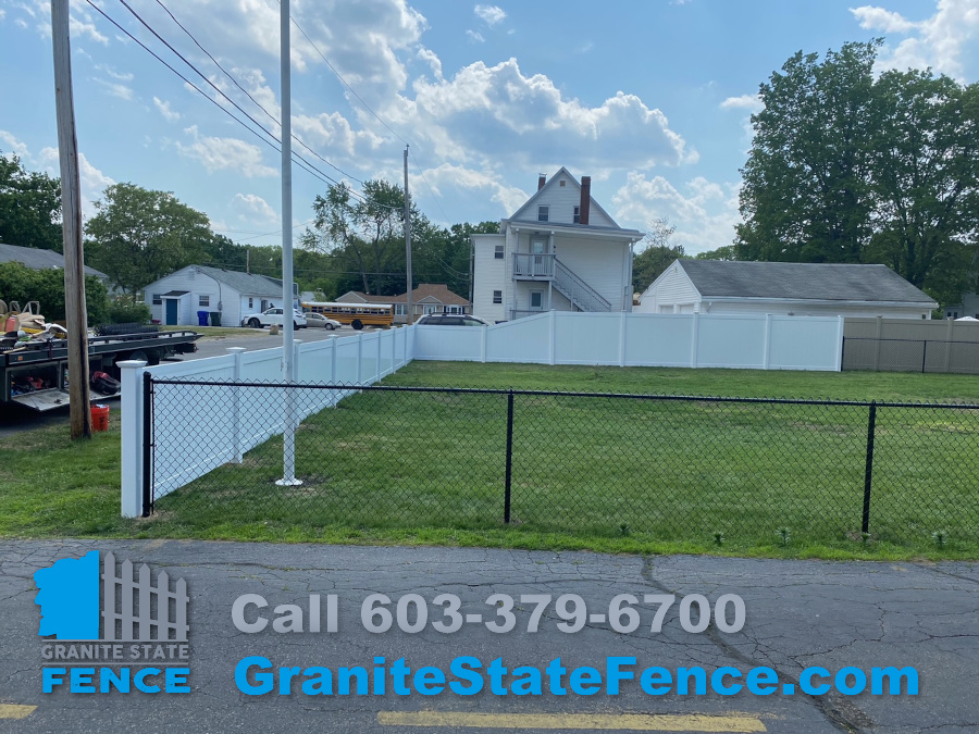 White Vinyl Fencing and Black Chain Link Fencing installed in Manchester, NH.