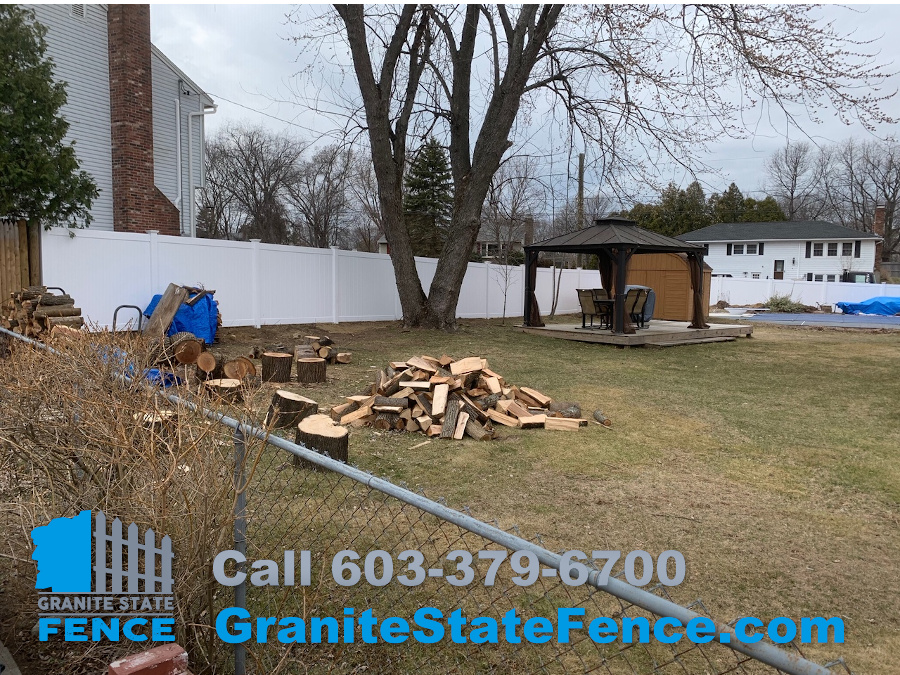 White Vinyl Privacy Fence for a large backyard containment area in Nashua, NH