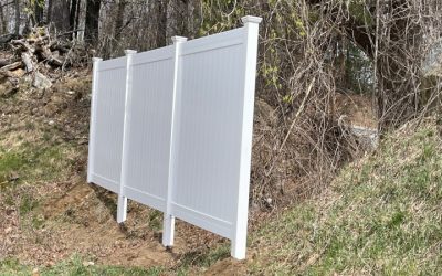 White Vinyl Privacy Fencing installation in Derry, NH.