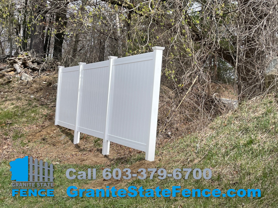White Vinal Privacy Fencing installation in Derry, NH.