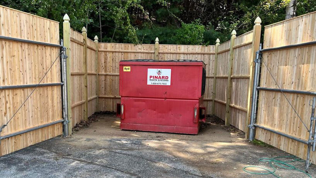 Cedar Privacy Dumpster Enclosure installation in Manchester, NH.