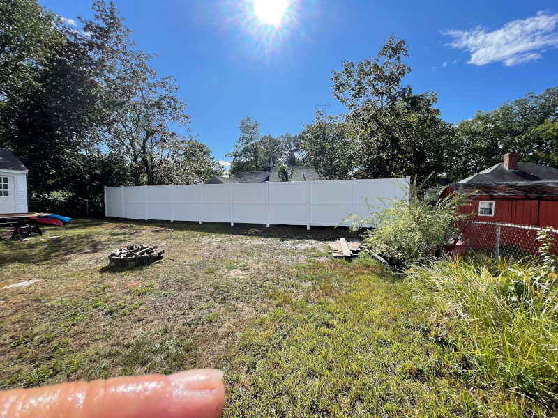 Check out this stunning 8' White Vinyl Privacy Fence installed by Granite State Fence in Manchester, NH! Raised higher per customer request, it’s a perfect blend of privacy and quality. With years of expertise, we exceed expectations every time. Contact us for a free estimate! #FenceInstallation #ManchesterNH #GraniteStateFence
