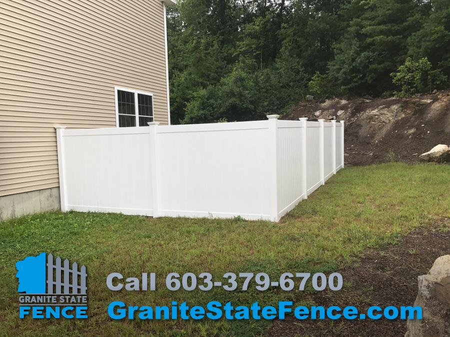 Vinyl fence installation in Windham, NH by Granite State Fence contractors.