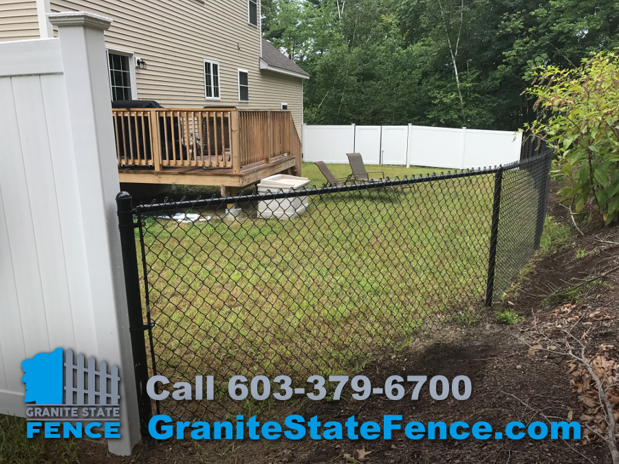 Fence installation in Windham, New Hampshire. Black chain link fences.