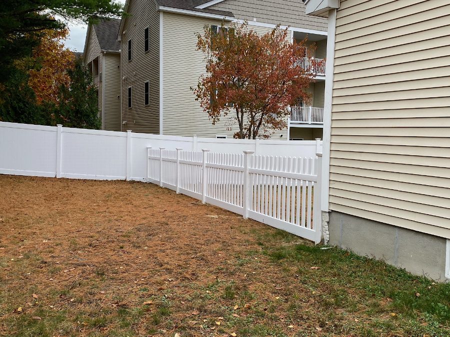 Vinyl Picket Fence installed for pet safety in Derry, NH.