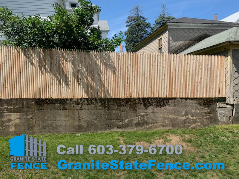 Londonderry Fence Company installs cedar stockade fence in Nashua, NH.