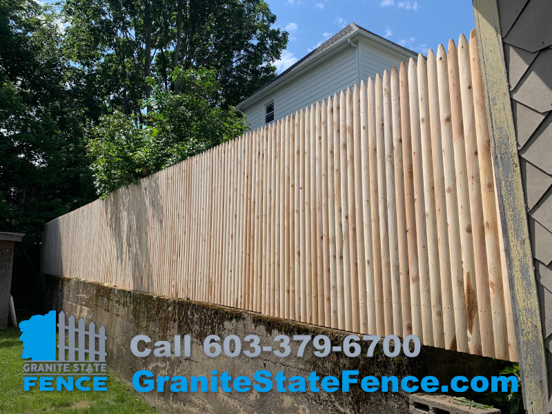 Londonderry Fence Company installs cedar stockade fence in Nashua, NH.