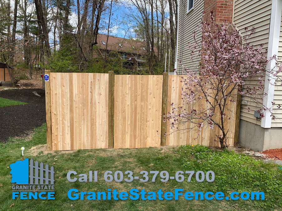 Cedar Panel Fence with Round Posts installed in Nashua, NH.