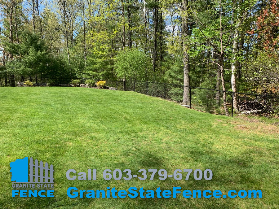 Chain Link fence combined with 2 rail aluminum fencing in Nashua, NH.