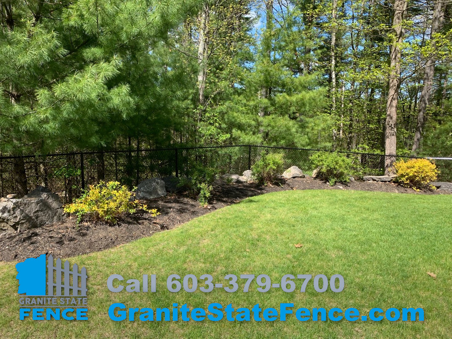 Chain Link fence combined with 2 rail aluminum fencing in Nashua, NH.