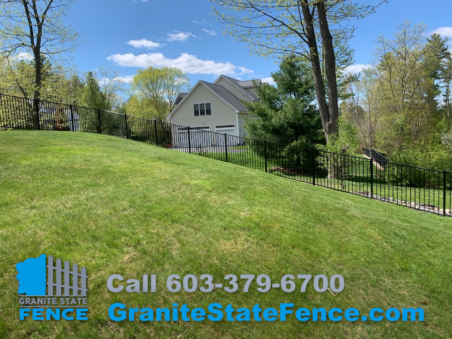 Chain Link fence combined with 2 rail aluminum fencing in Nashua, NH.