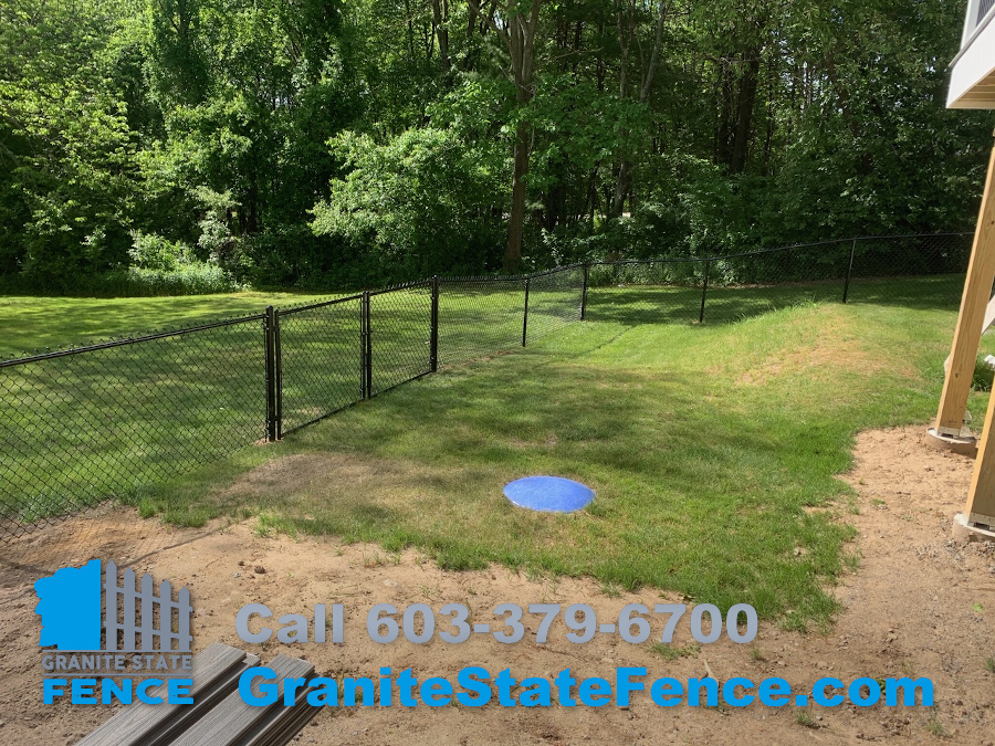Chain Link fence installed to enclose patio area in Hudson, NH.