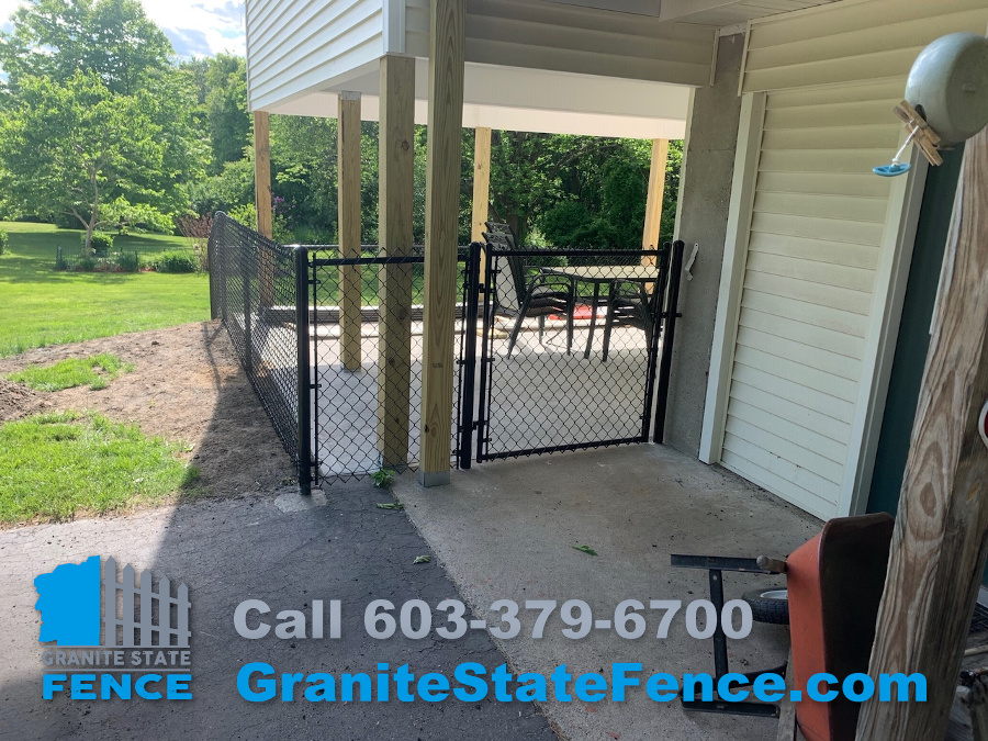 Chain Link fence installed to enclose patio area in Hudson, NH.