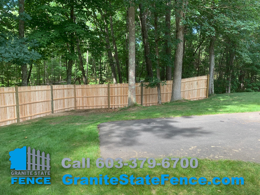 Cedar Stockade Fence installation in Londonderry, NH.