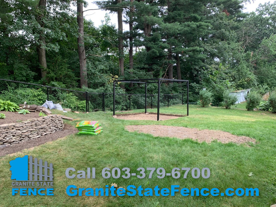 Vinyl Coated Chain Link Fence installation in Manchester, NH.
