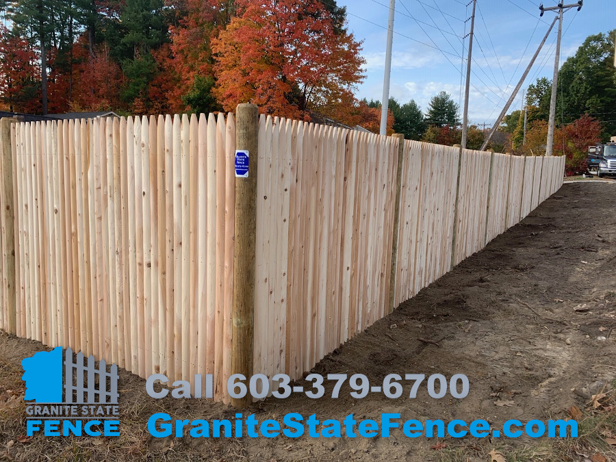 Cedar Stockade Fence installation in Hudson, NH.