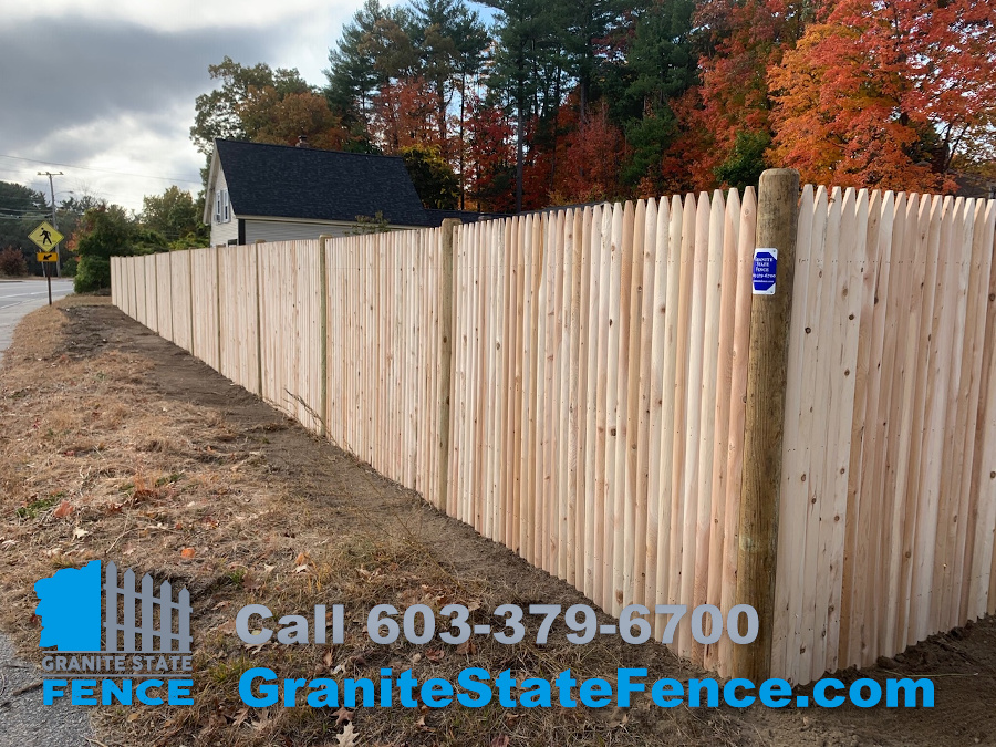 Cedar Stockade Fence installation in Hudson, NH.