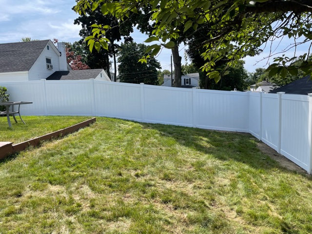 We installed 6’ white vinyl privacy fencing for this yard and pool in Manchester, NH.