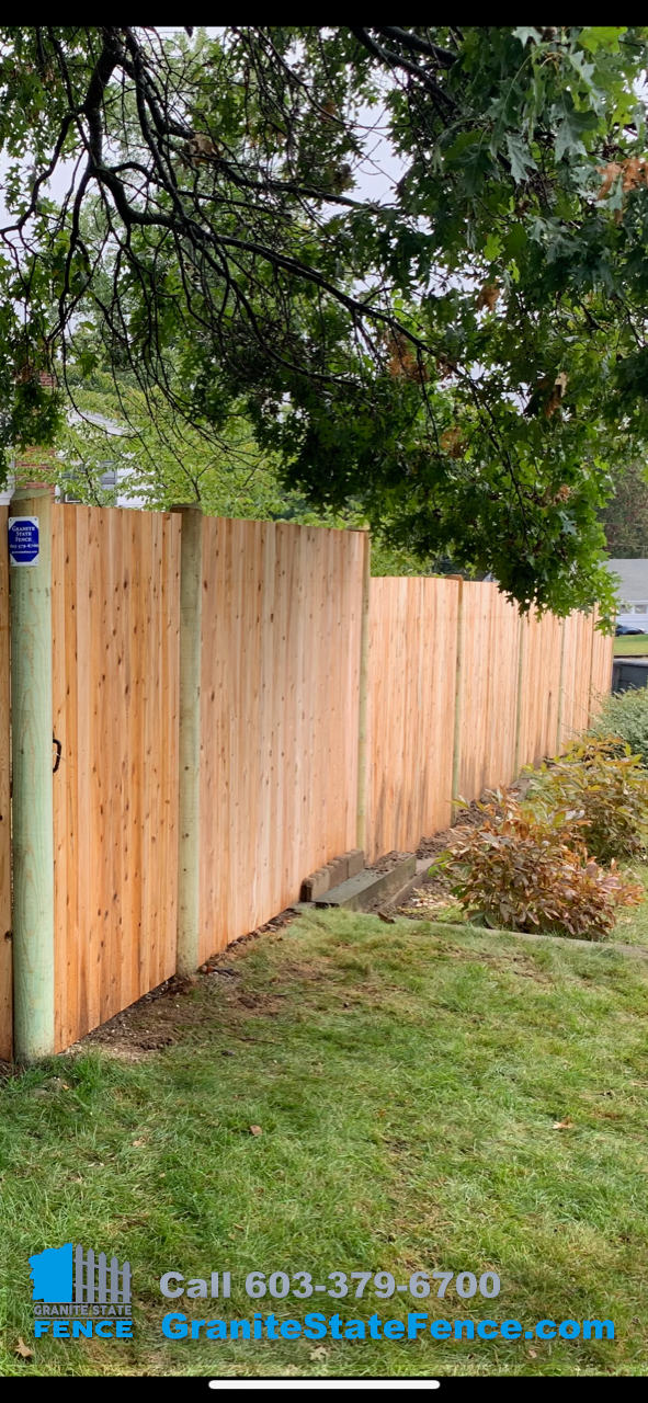 Cedar Stockade Fence installed in Manchester, NH.