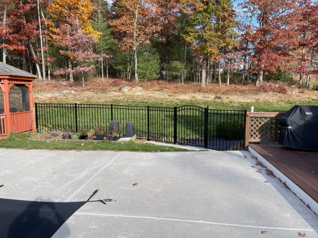 Granite State Fence installed a black aluminum safety fence for this pool owner in Merrimack, NH. 