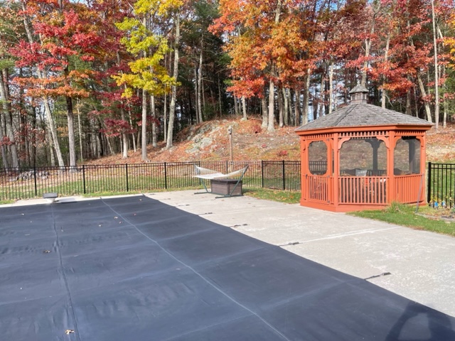 Granite State Fence installed a black aluminum safety fence for this pool owner in Merrimack, NH. 