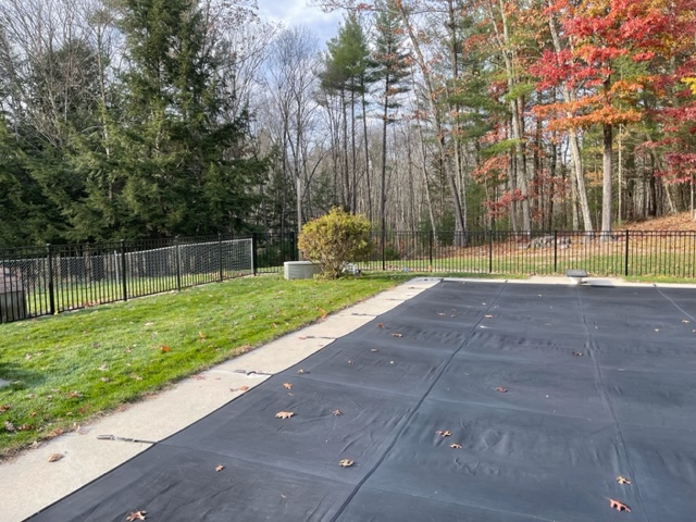 Granite State Fence installed a black aluminum safety fence for this pool owner in Merrimack, NH. 