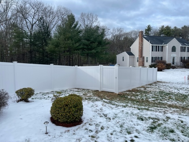 Granite State Fence installed a white vinyl privacy fence for a residential property in Londonderry, NH.