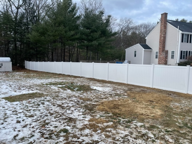 Granite State Fence installed a white vinyl privacy fence for a residential property in Londonderry, NH.
