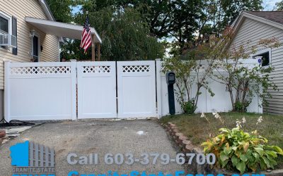 White Vinyl Privacy Fence with Double Drive Gates installed in Manchester, NH.