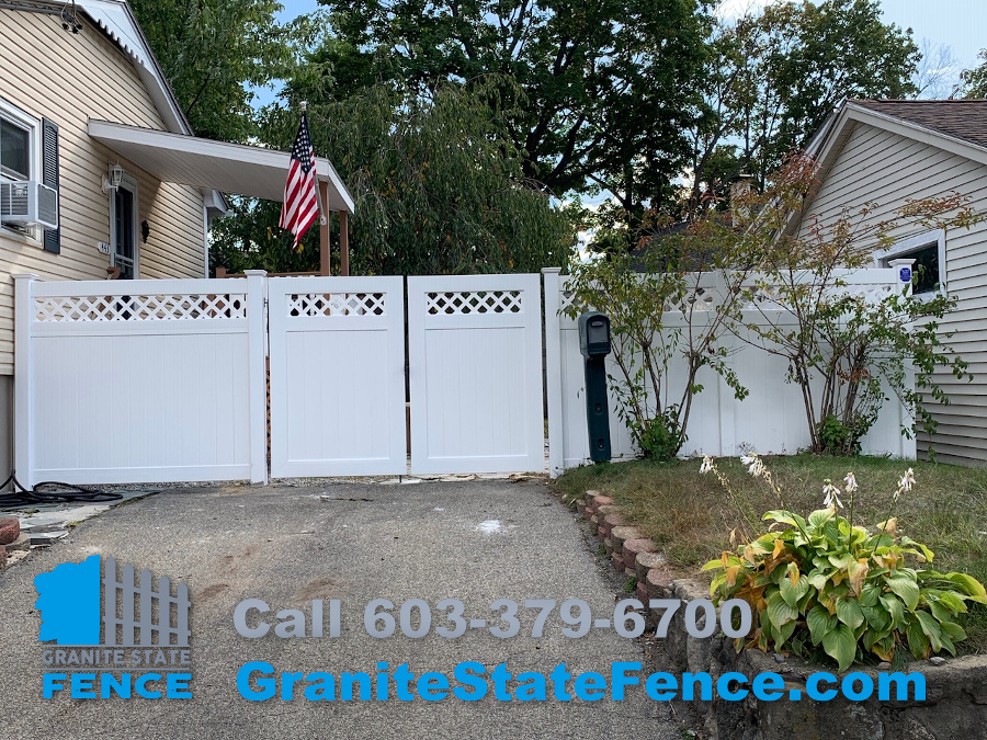 White Vinyl Privacy Fence with Double Drive Gates installed in Manchester, NH.