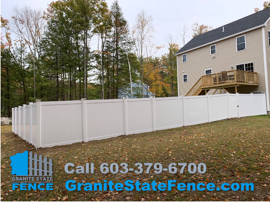 White Privacy Fence Install for a backyard in Raymond, NH.