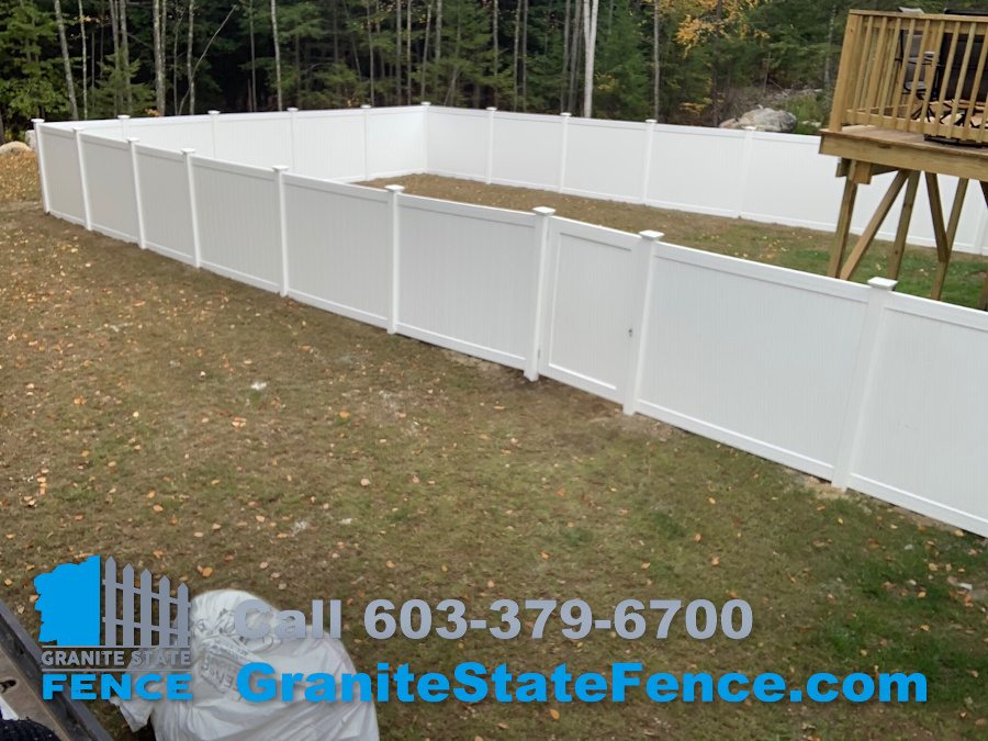 White Privacy Fence Install for a backyard in Raymond, NH.